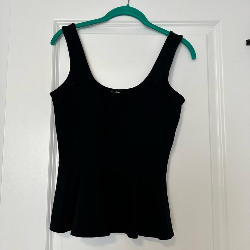 BEBE black peplum top size M